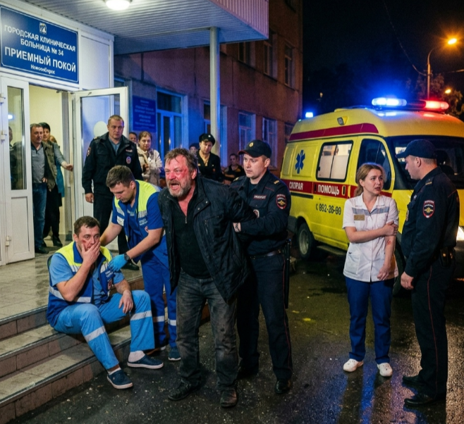 Приемный покой Городской клинической больницы № 34 в Новосибирске, где развернуты посты охраны и установлены камеры внутреннего видеонаблюдения для фиксации правонарушений.